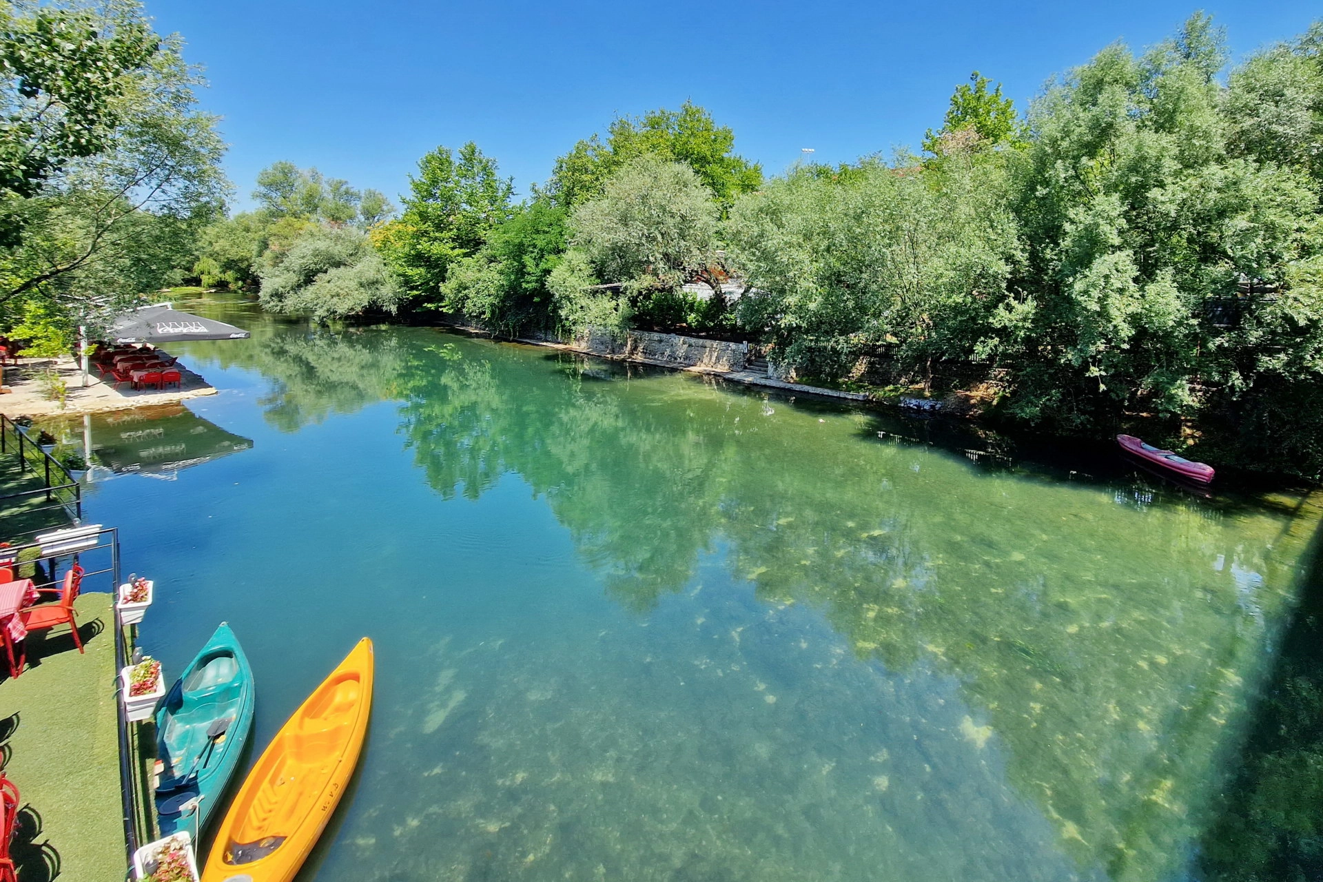 Canoes on the Buna River beside Camp Aganovac