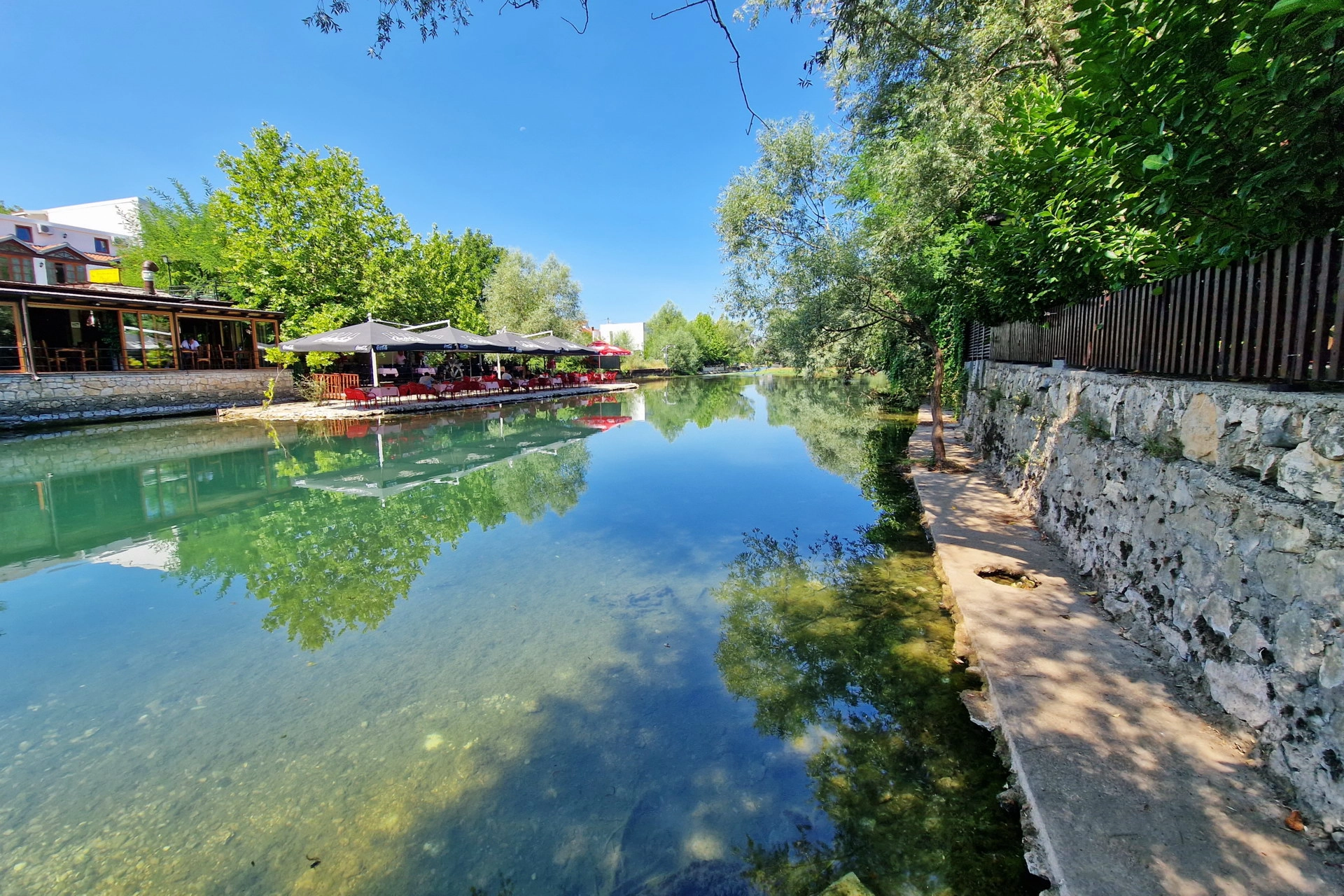 Buna river path with mirror reflections